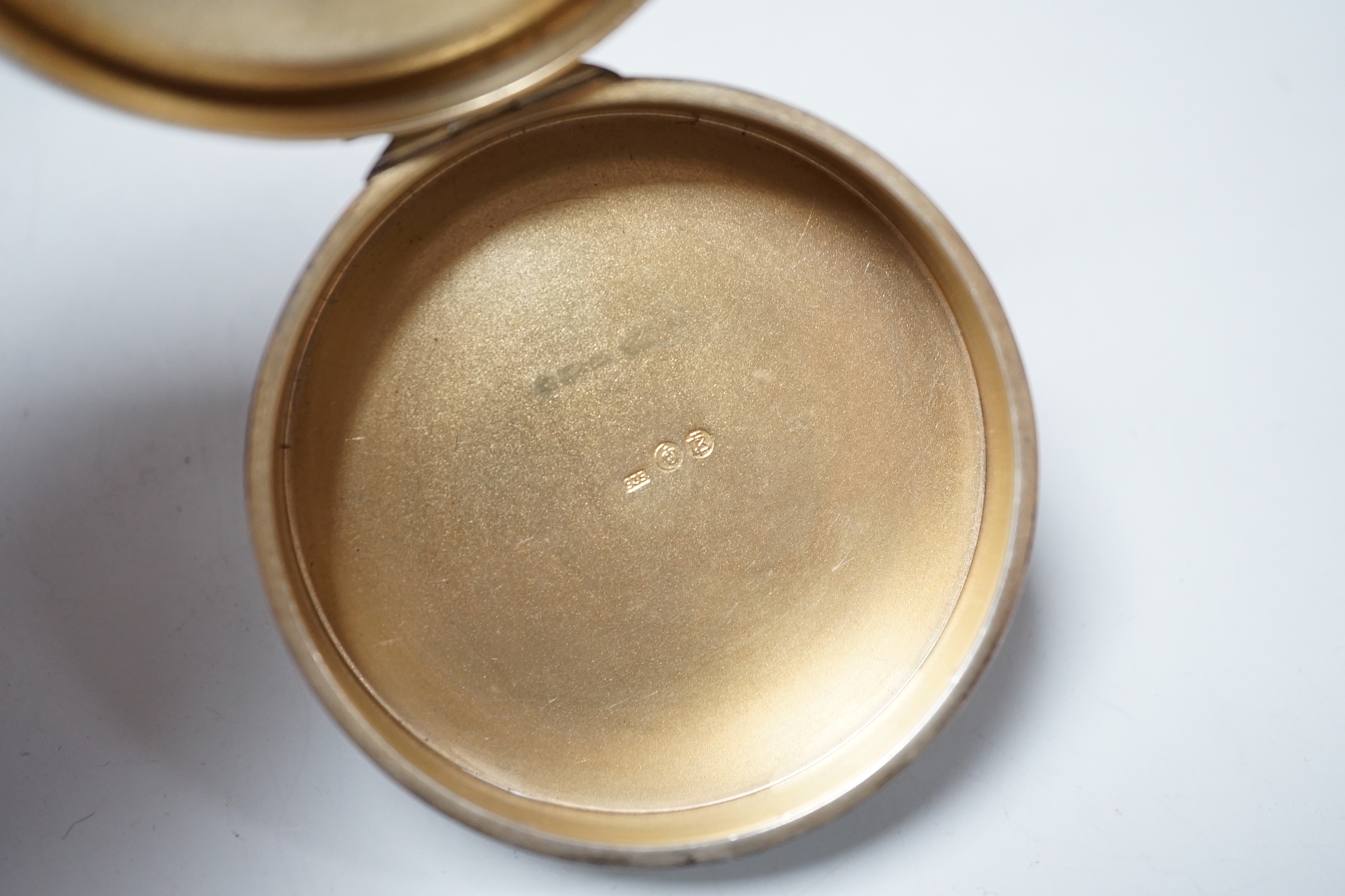 A German silver and enamel circular powder box, decorated with dancing maidens, import marks for Edinburgh, 1952?, 69mm.